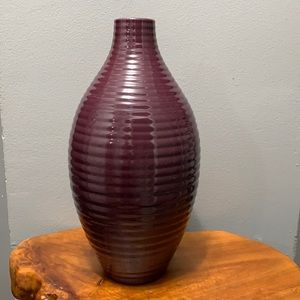 Purple ribbed vase.